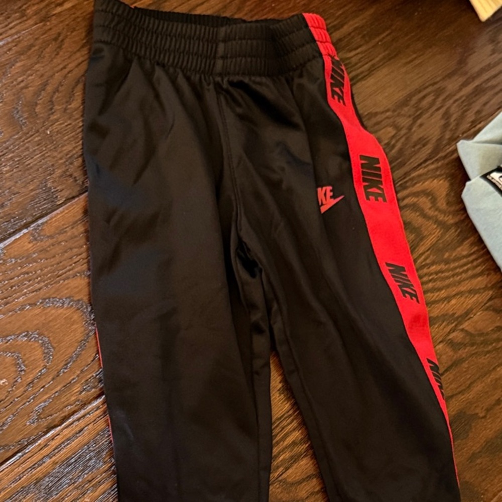 Nike Kids Black Joggers with Red Accents